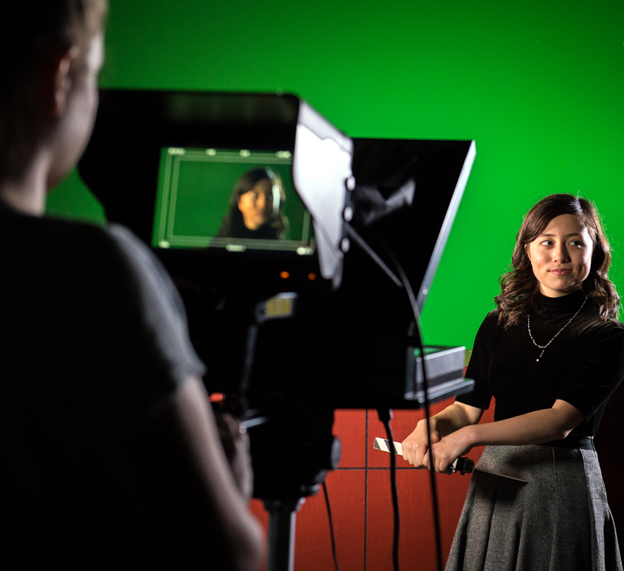 students film in front of a green screen